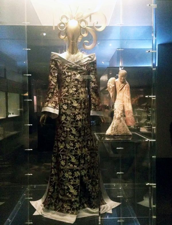 Figure 2: A dress by Alexander McQueen (British, 1969-2010) is juxtaposed with a Han Dynasty (206 BCE - 220 CE) figurine to invoke the inspirational linkages. China Through the Looking Glass, Metropolitan Museum of Art, New York City. 2015. Photo courtesy of author

