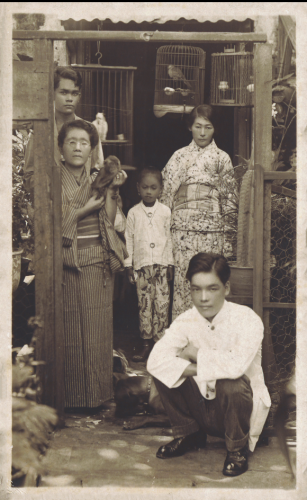 Figure 7. This nengajō shows five individuals dressed in various traditional and modern dress, and surrounded by their pets. Lim Shao Bin collection, National Library, Singapore.