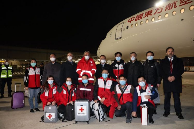 Members of the Chinese medical aid team at Fiumicino Airport in Rome, Italy, 12 March 2020. Photo courtesy of http://en.people.cn/n3/2020/0317/c90000-9668847.html)