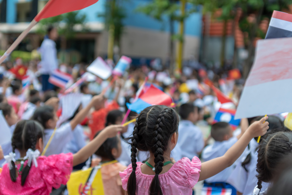 Celebrate ASEAN Day falls on Aug. 8,Students hand holding carry the flag of of the Association of Southeast Asian Nations,Celebrating 47 years of ASEAN,Happy with celebration