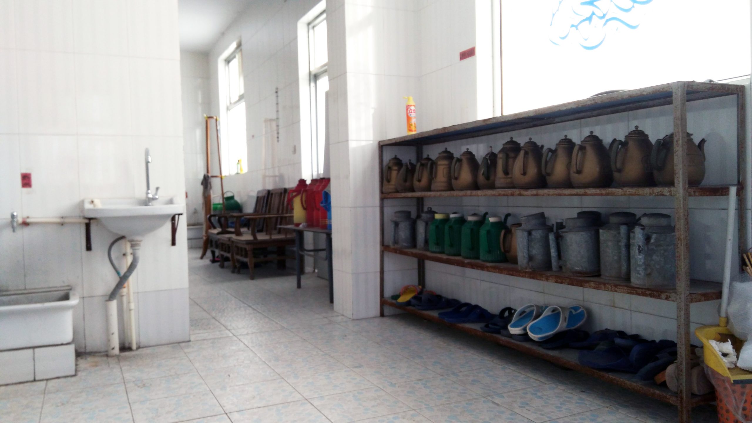 Plastic and metal pitchers in the washroom of a mosque in Zibo, Shandong. Photo courtesy of the author.