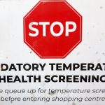 Temperature health screening checkpoint at a local mall.