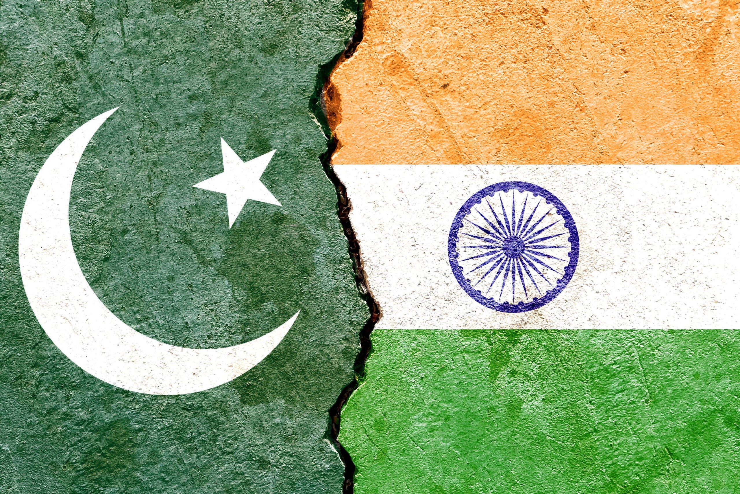 Grunge,Pakistan,Vs,India,National,Flags,On,Broken,Wall,Background,